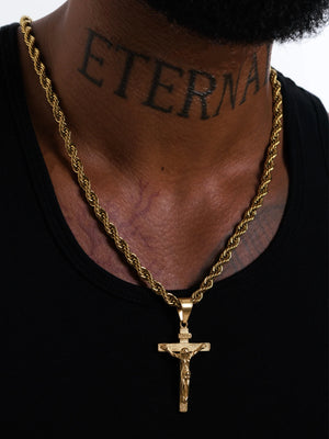 Crucifix pendant and 6mm rope chain sitting mid chest on the model