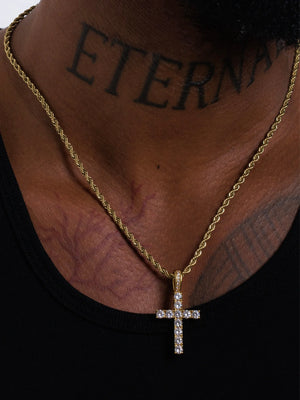 Cross pendant on a 3mm rope chain sitting mid chest at the 20 inch length