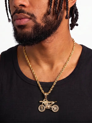 Man wearing the gold filled bike pendant on a 6mm rope chain