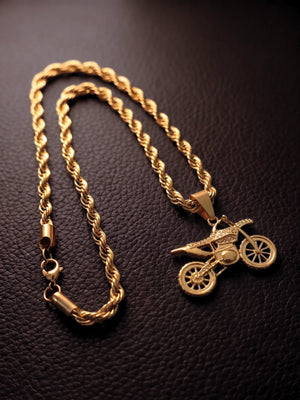 Gold filled bike pendant and 6mm rope chain with lobster clasp laid flat