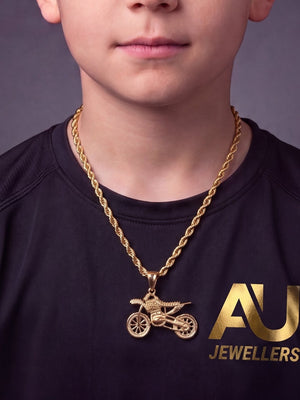 Kids Gold Filled Bike Pendant On A 6mm Rope Chain worn on model, close-up