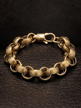 Close view of the 15mm belcher bracelet showing the scroll engraving across each patterned link