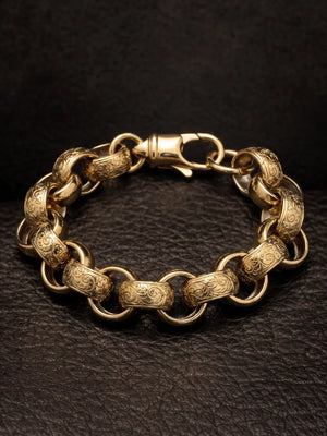 Close view of the 15mm belcher bracelet showing the scroll engraving across each patterned link