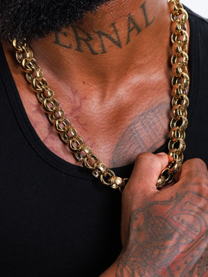 The 15mm patterned belcher chain held in hand showing the weight of the links
