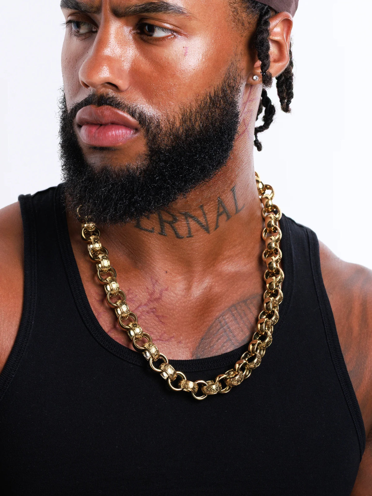 Model portrait wearing the 9ct gold filled 15mm patterned belcher chain
