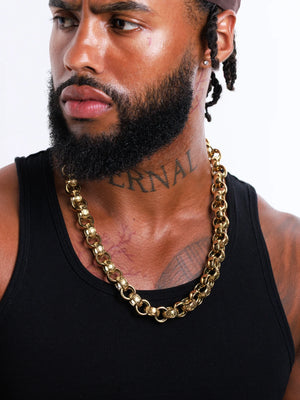 Model portrait wearing the 9ct gold filled 15mm patterned belcher chain