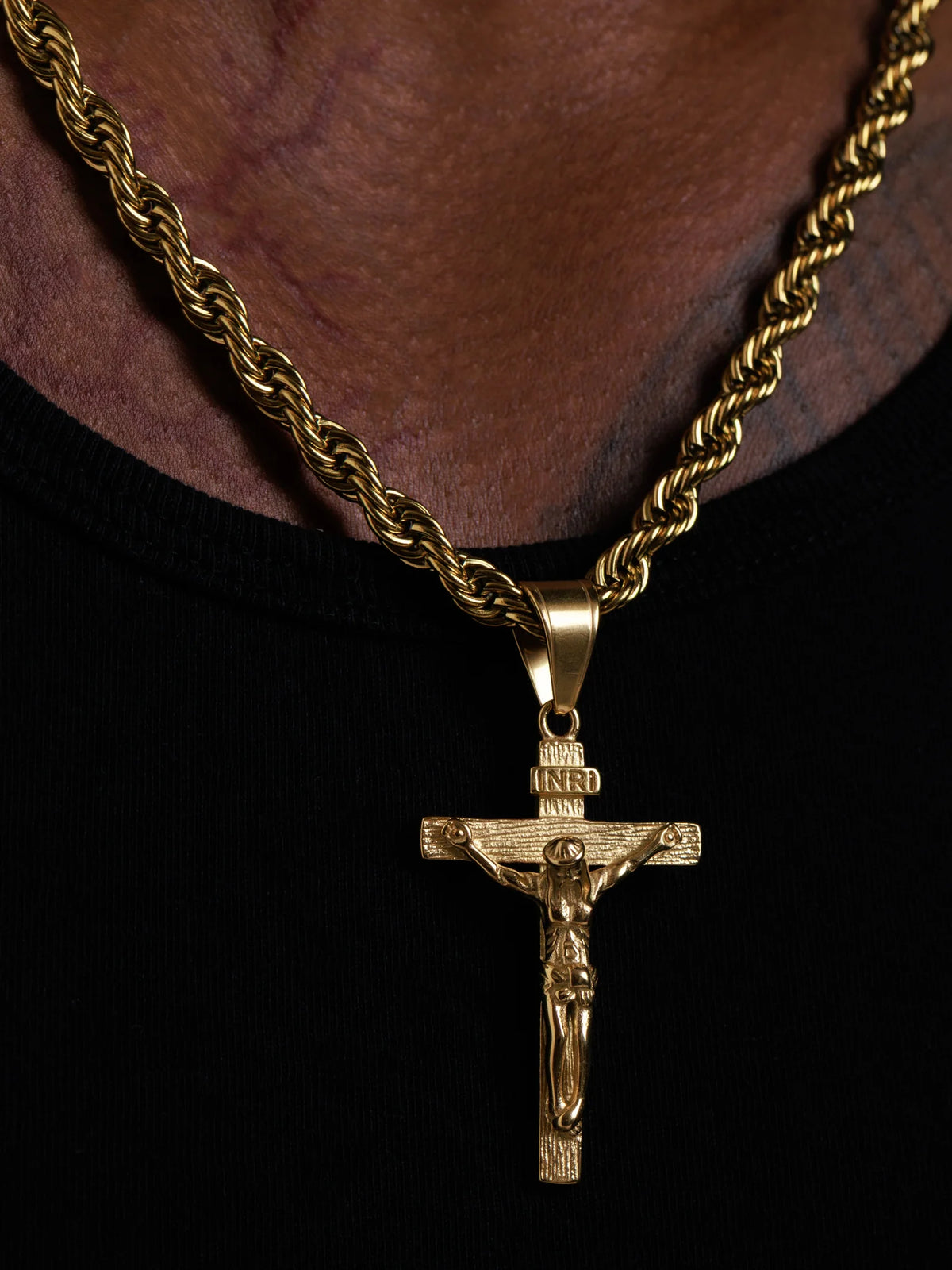 Close view of the INRI crucifix pendant showing the detailed figure and bail