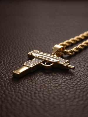 Angled view of the stone set uzi pendant beside the 6mm rope chain