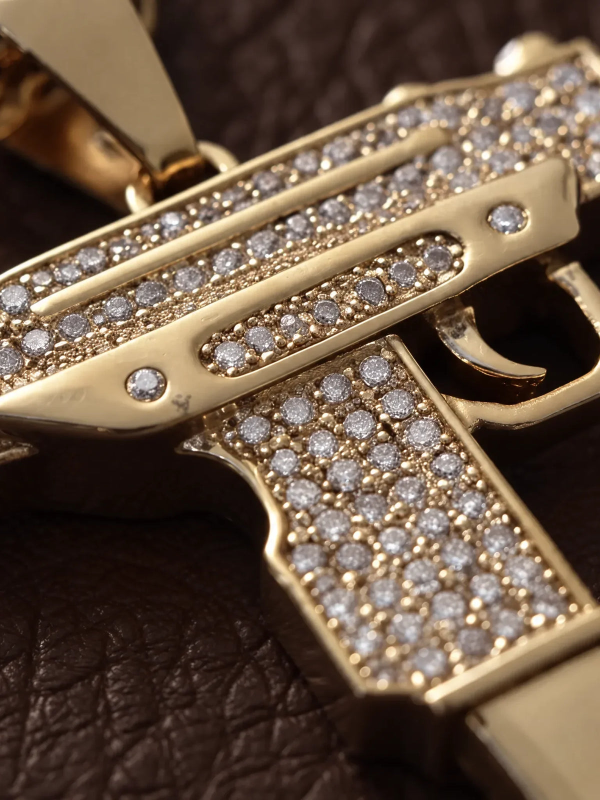 Macro detail of the pave stone setting across the face of the uzi pendant