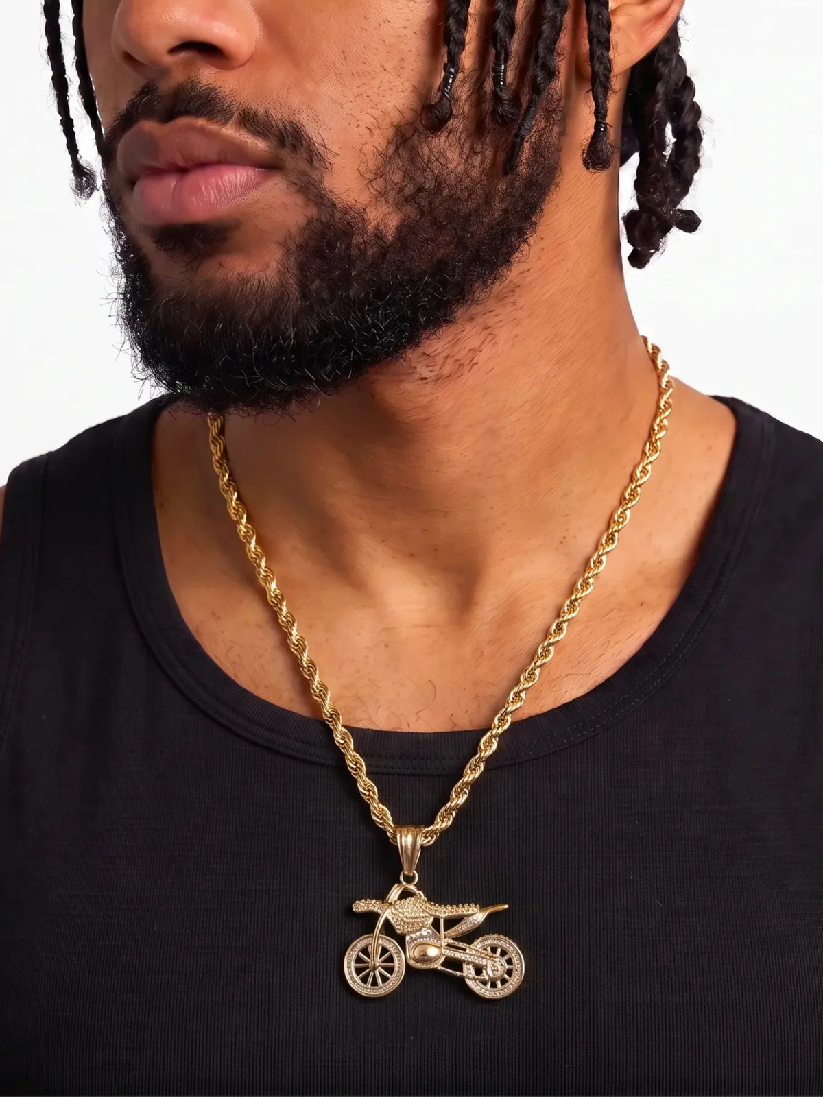 Man wearing the gold filled bike pendant on a 6mm rope chain