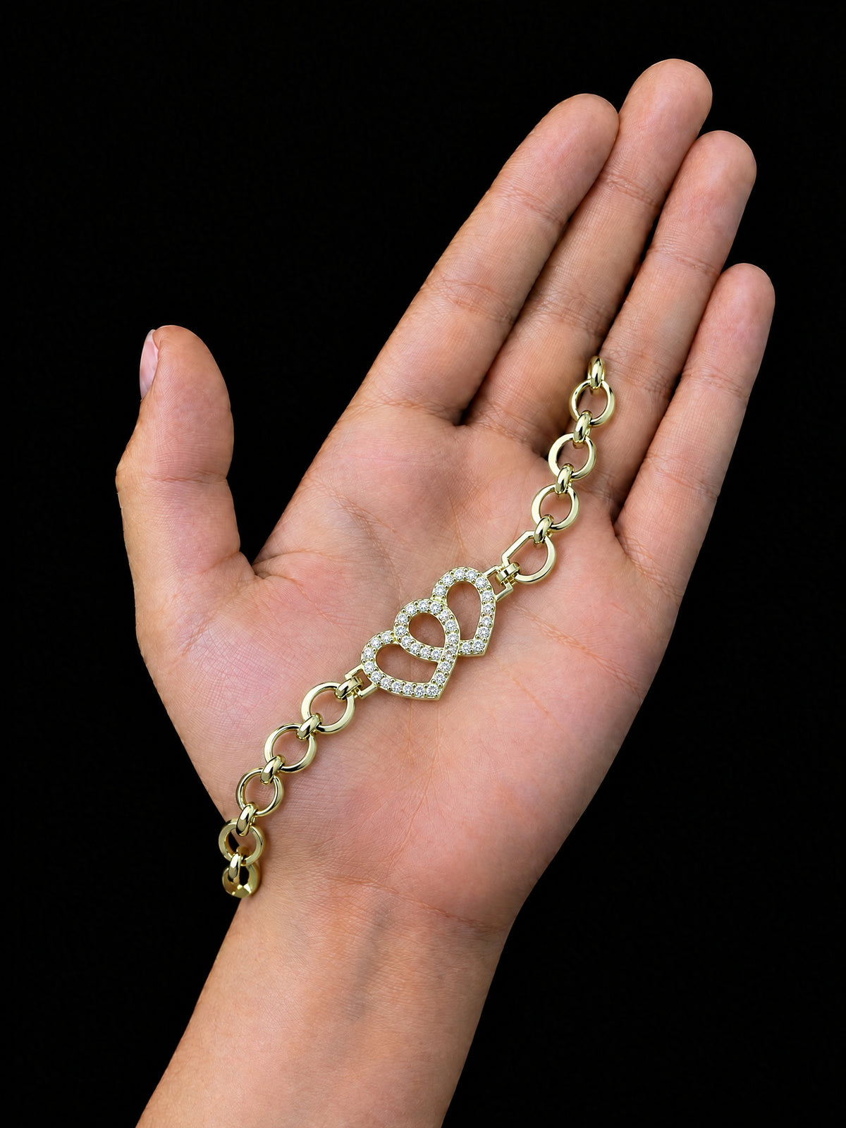 Girls Double Love Heart Charm Belcher Bracelet Gold Filled shown across a child's palm for size