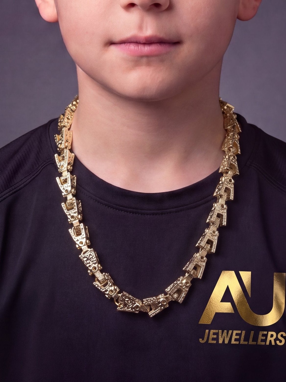 Kids 9ct Gold Filled Lego Chain 10mm worn on model, close-up