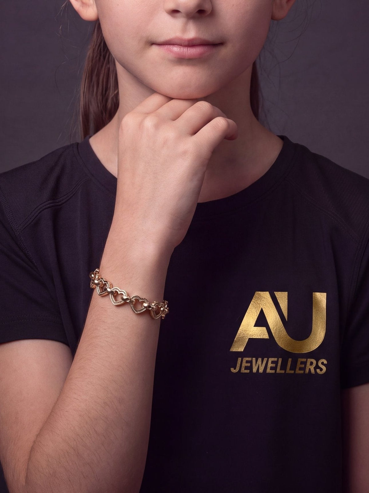 Kids 9ct Gold Filled Love Heart Belcher Bracelet 9mm worn on model, close-up