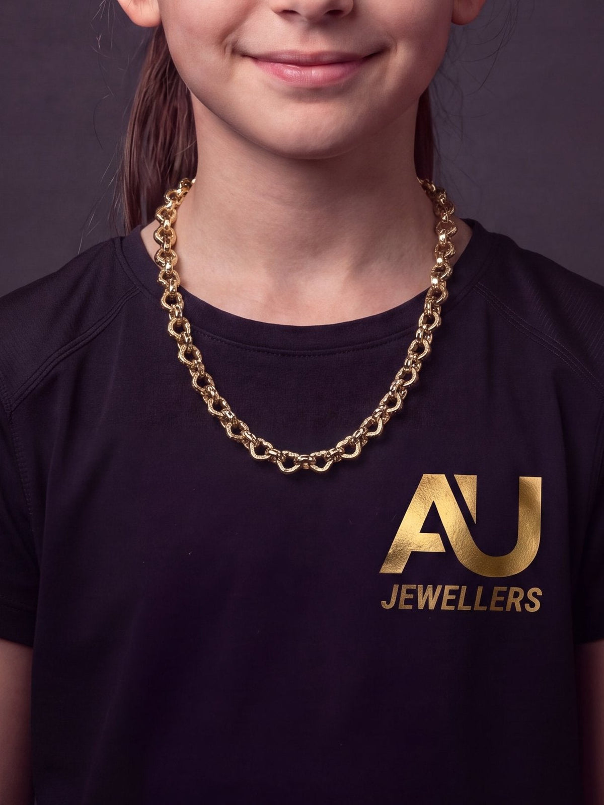 Kids 9ct Gold Filled Love Heart Belcher Chain 9mm worn on model, close-up