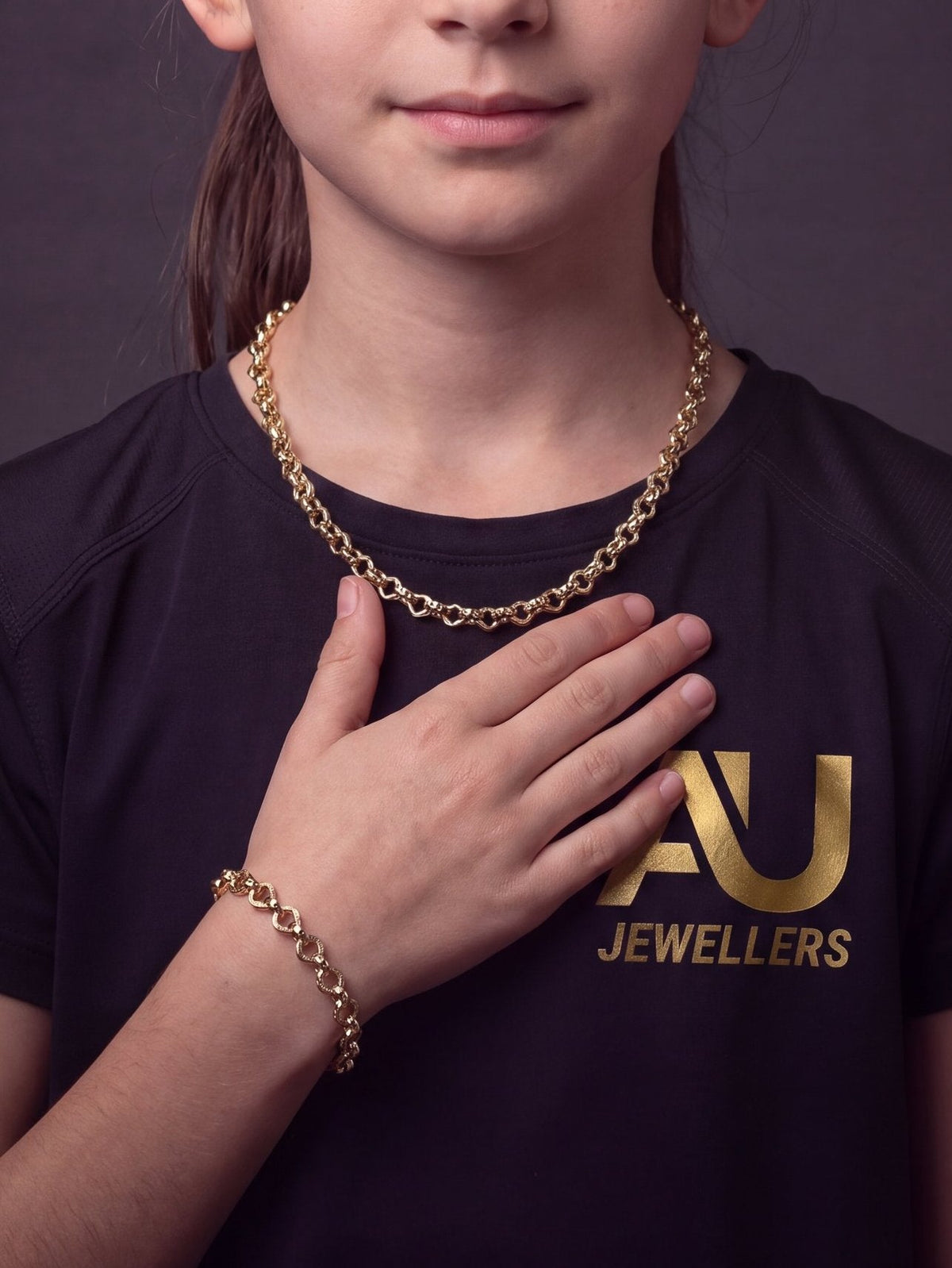 Kids 9ct Gold Filled Love Heart Belcher Set 9mm worn on model, close-up