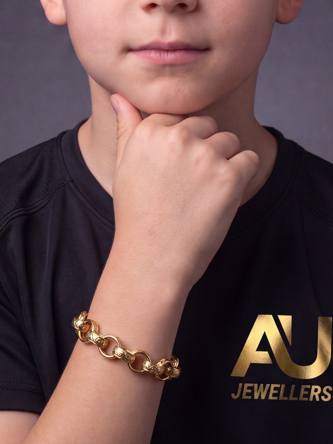 Kids 9ct Gold Filled Patterned Oval Belcher Bracelet 13mm worn on model, close-up