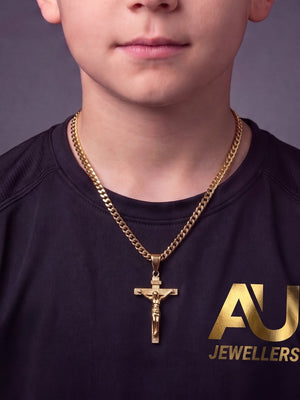 Kids Gold Filled Crucifix Pendant on a 4mm Franco Chain worn on model, close-up
