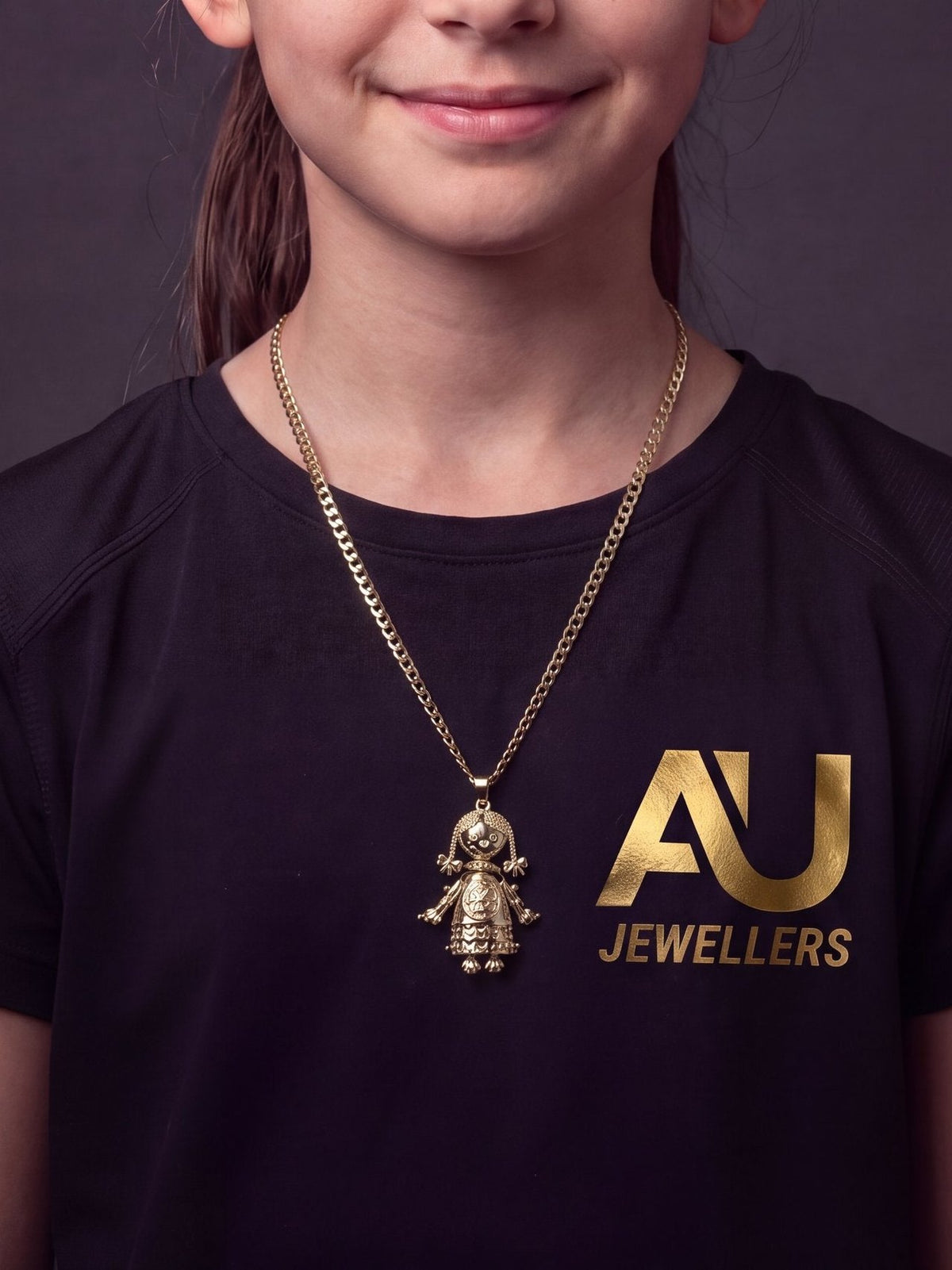Kids Gold Filled RagDoll Pendant On 4mm Curb Chain worn on model, close-up